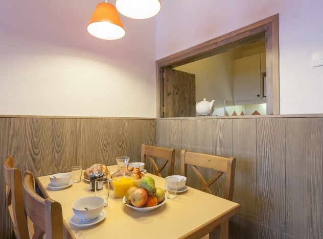 An image of a dining table in one of the apartments