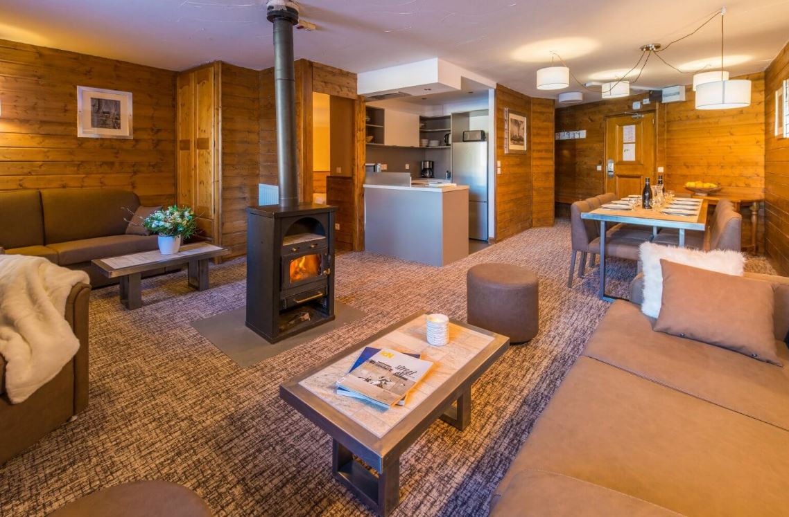 An image of a large apartment with wood burning stove
