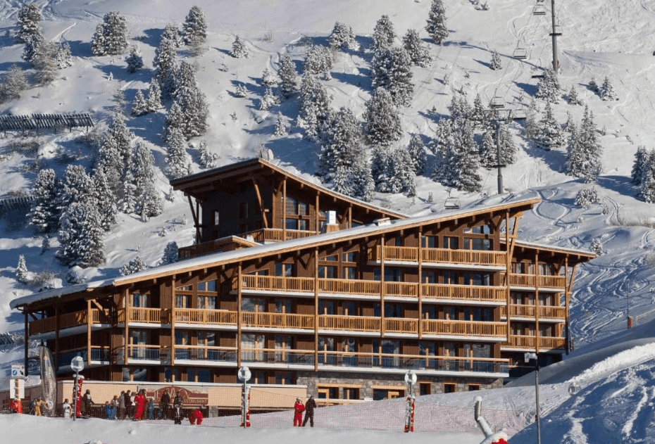 An image showing the Cime Des Arcs residence amongst the snowy surroundings
