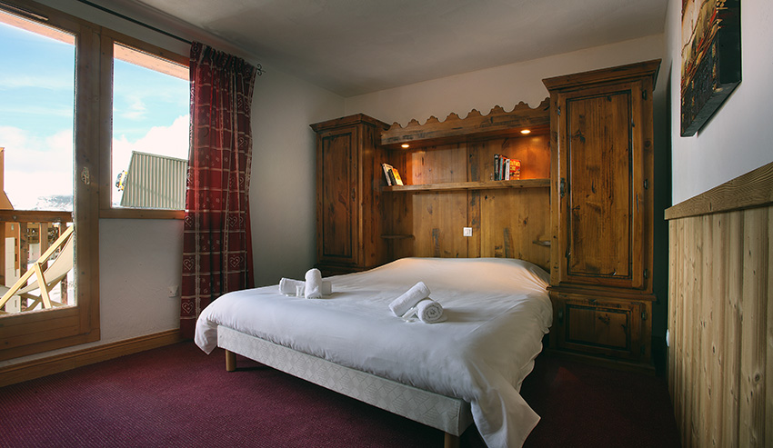 An image of one of the double bedrooms at Chalets des Neiges Plein Sud Val Thorens