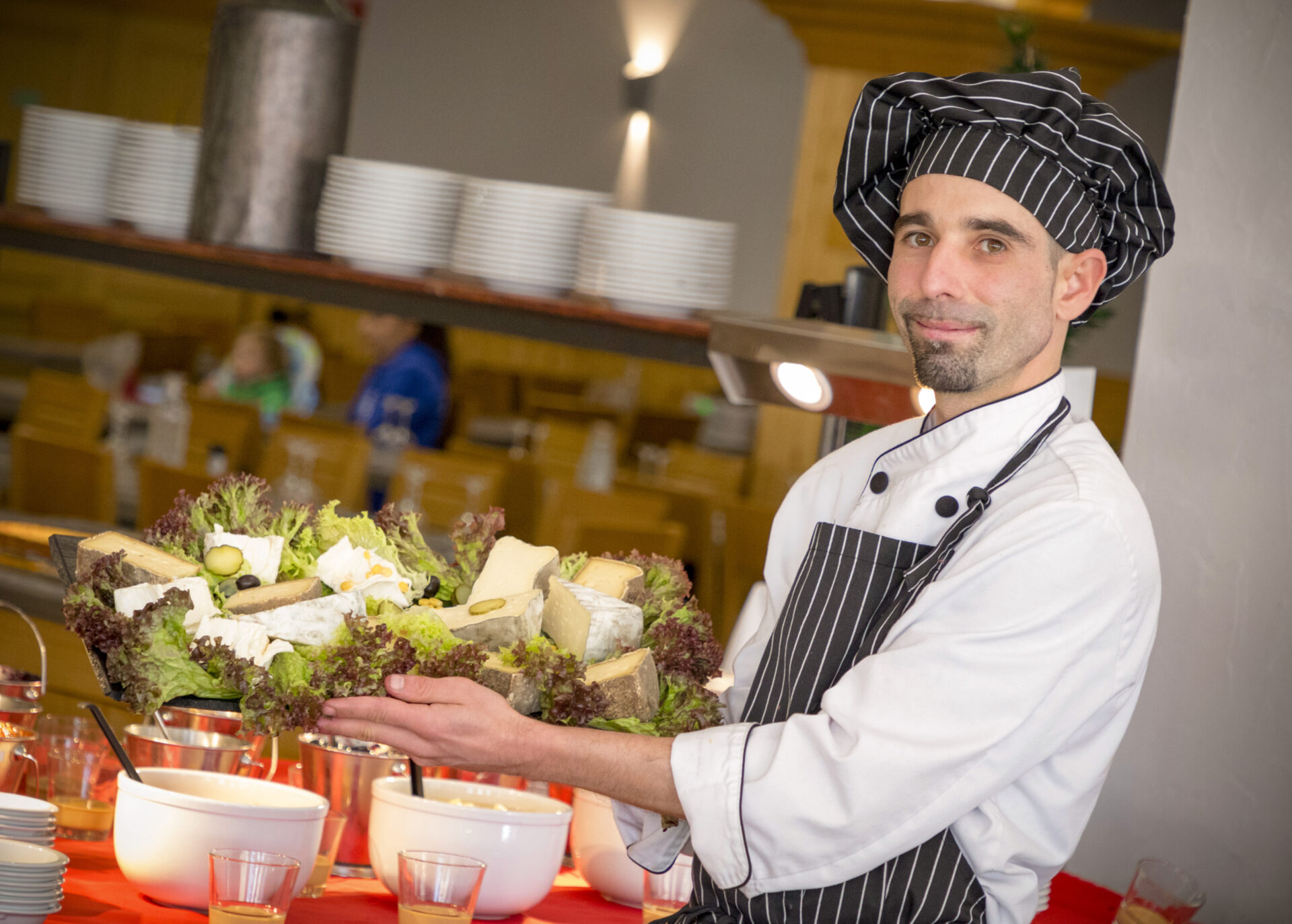 An image of the chef next to the buffet in the restaurant