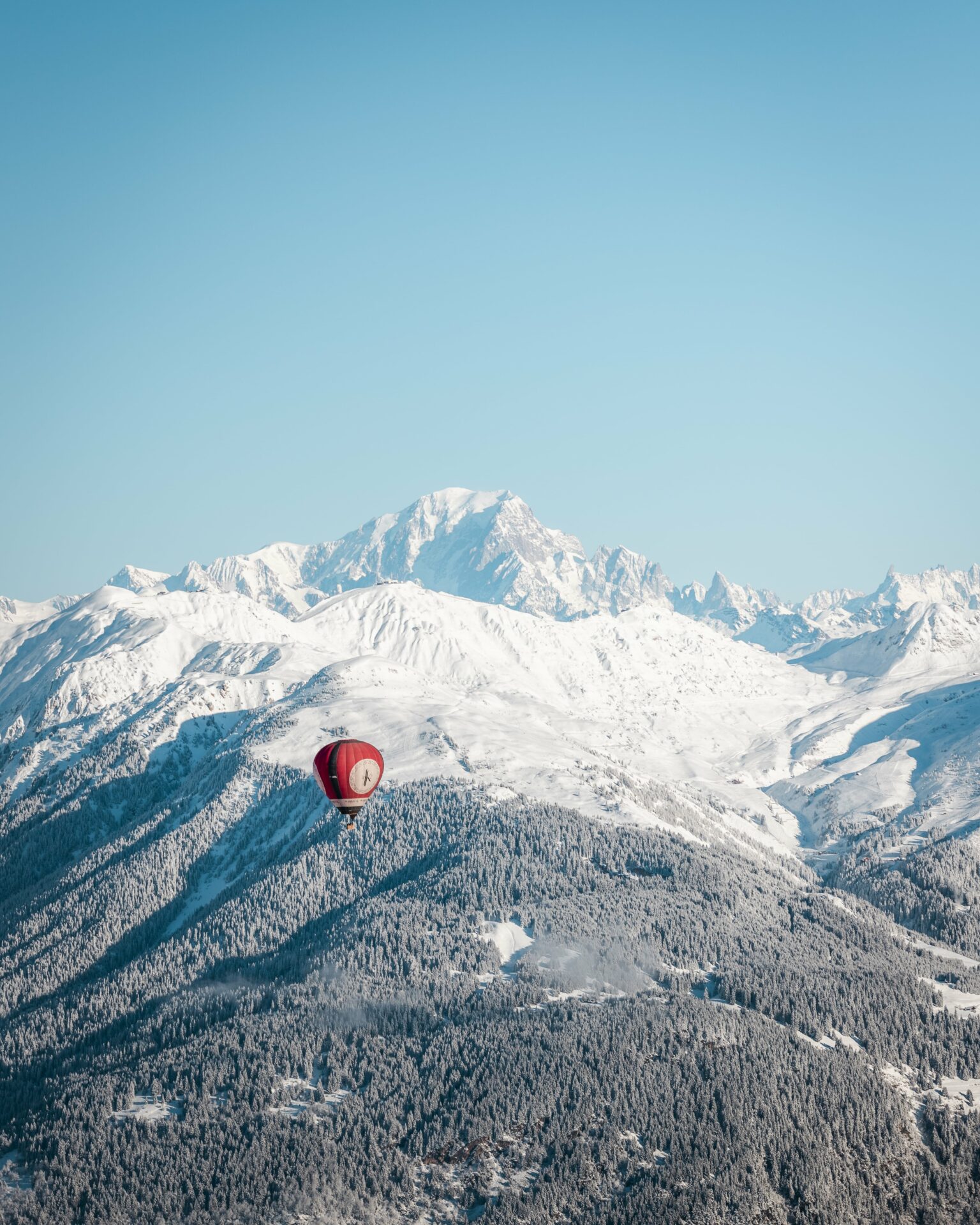 An image of a hot air balloon going over Courchevel