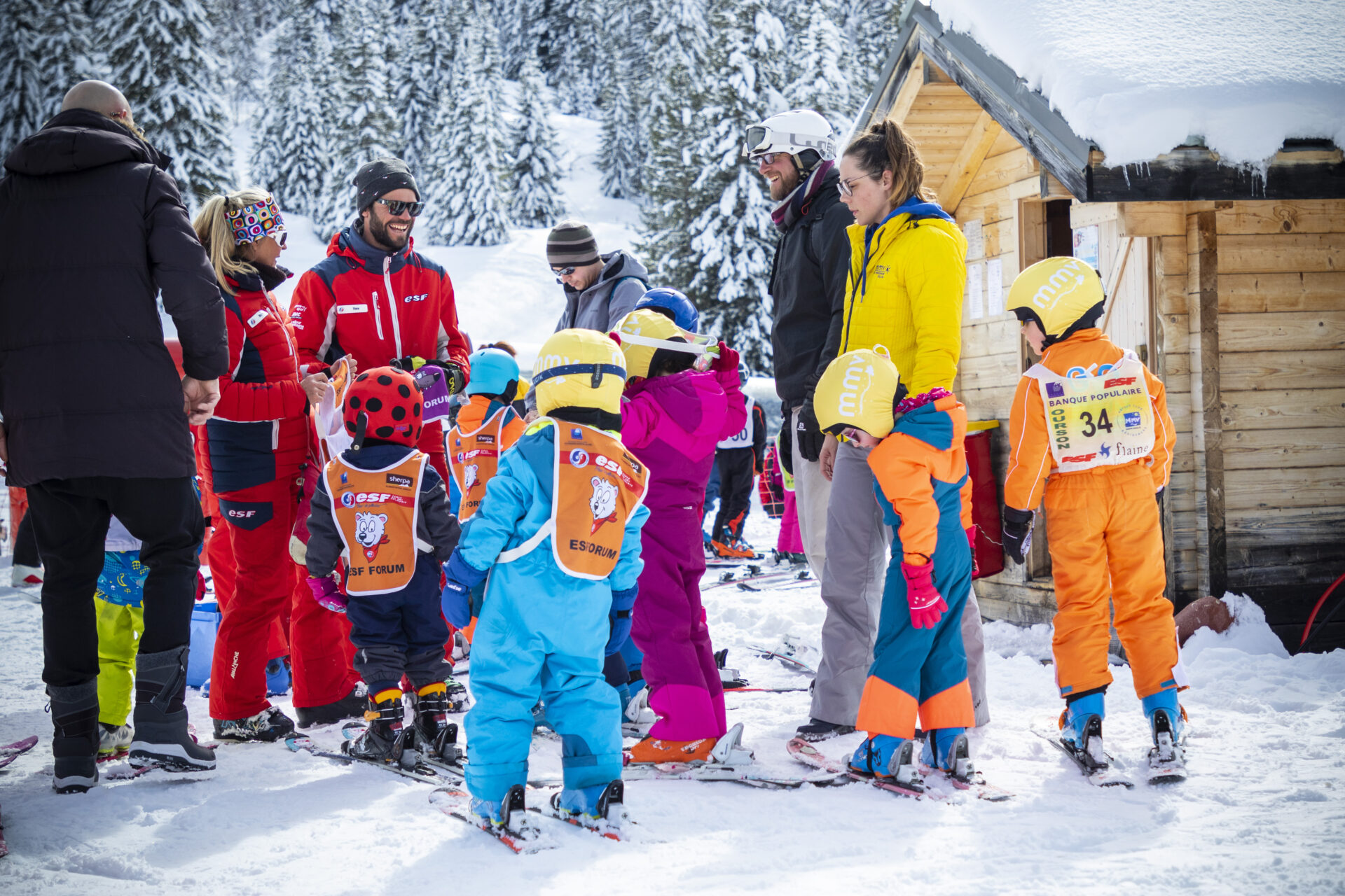 An image of children being escorting to the ski school