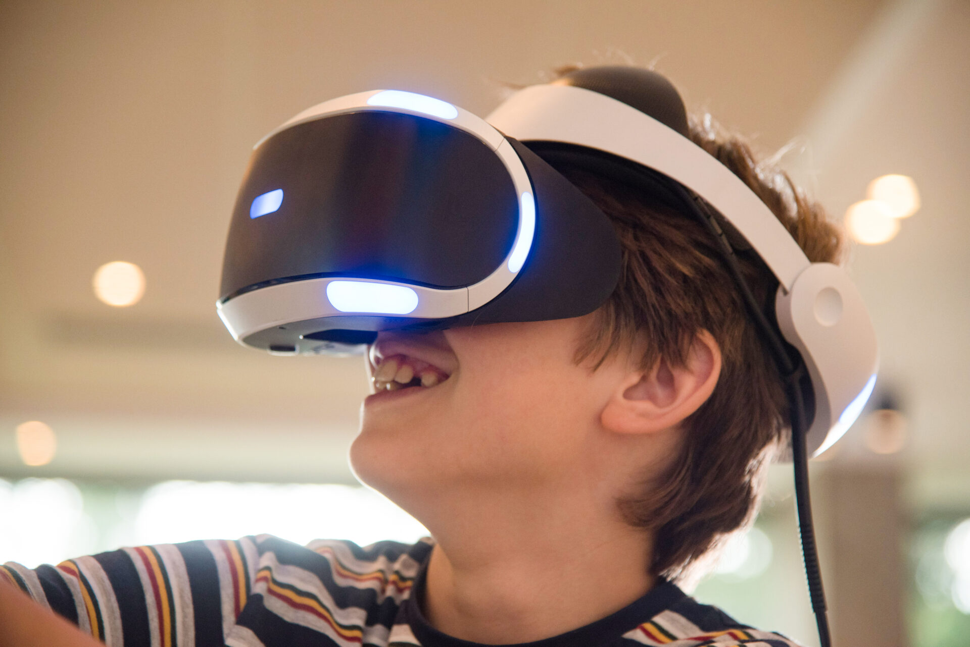 An image of a child playing on VR headset