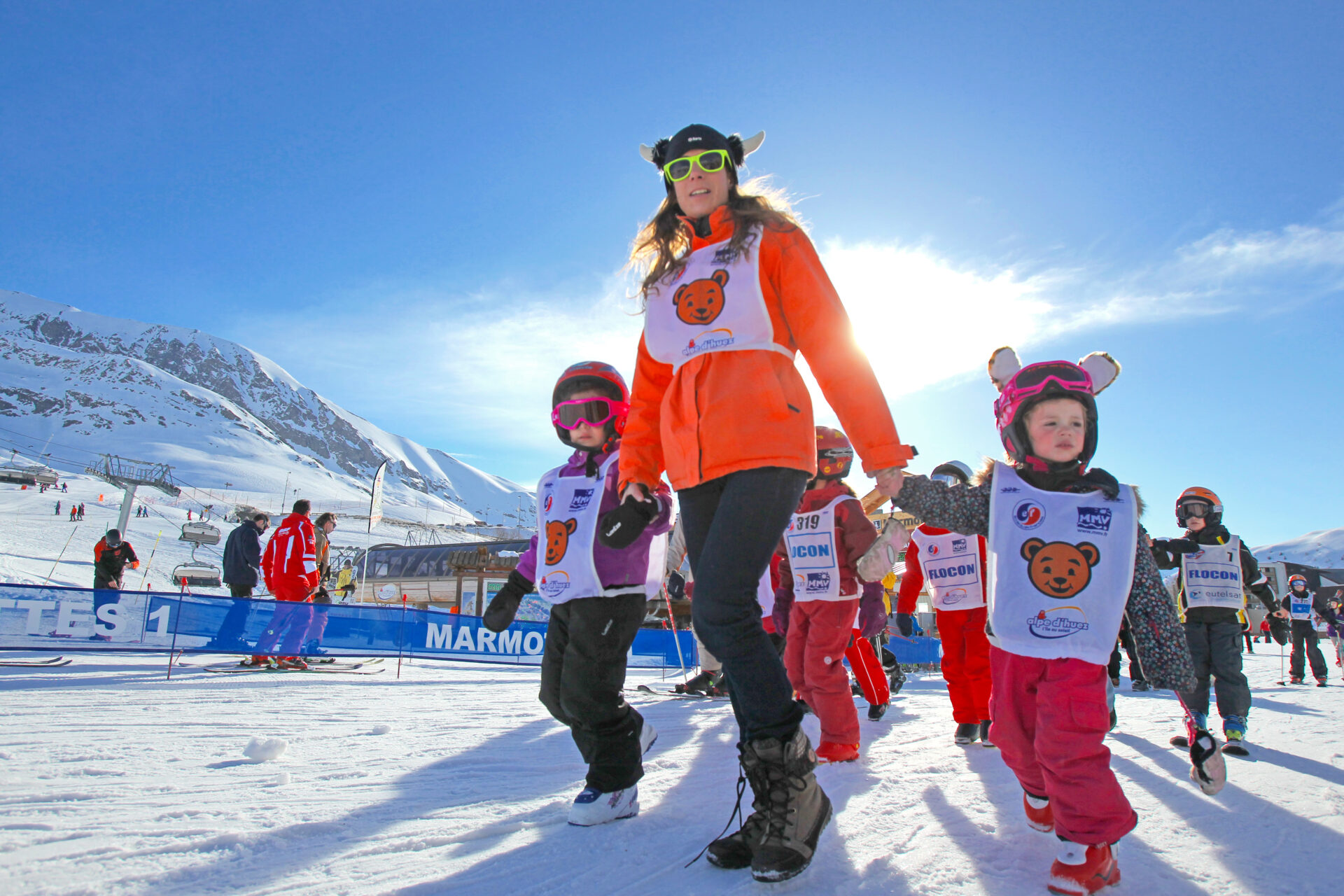 An image of MMV staff escorting children to the ski school