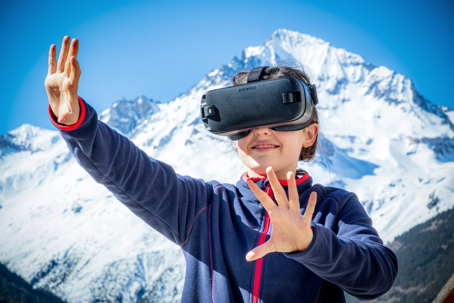 An image of a girl using a VR headset in the kids club