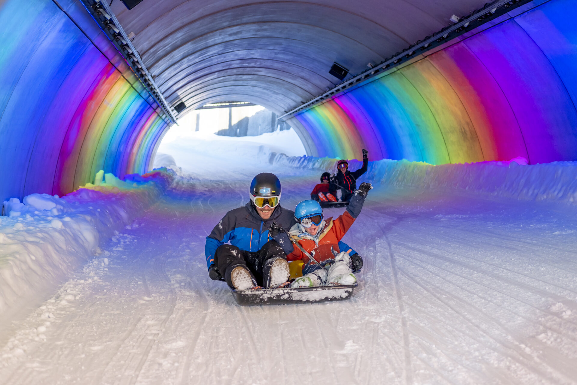 An image of a family sledging in Les Arcs